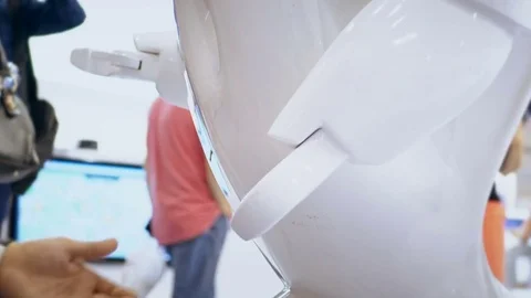 Modern Robotic Technologies. A man communicates with a robot, presses a plastic Stock Footage 82586962