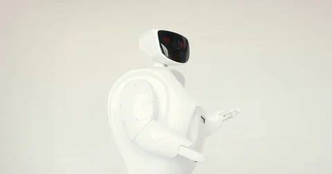 Modern Robotic Technologies. The robot looks at the camera at the person. The Video stock 80425556