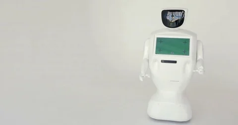 Modern Robotic Technologies. The robot looks at the camera at the person. The Video stock 80425870