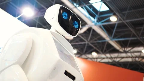 Modern Robotic Technologies. The robot looks at the camera at the person. The Stock Footage 81124480