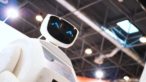 Modern Robotic Technologies. The robot looks at the camera at the person. The Stock Footage 81748225
