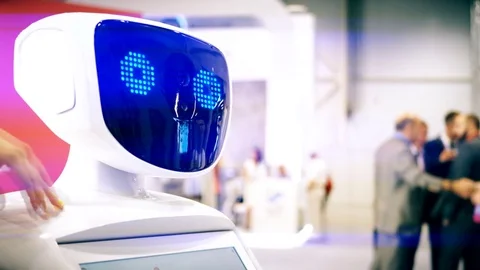 Modern Robotic Technologies. The robot looks at the camera at the person. The Stock Footage 82606714