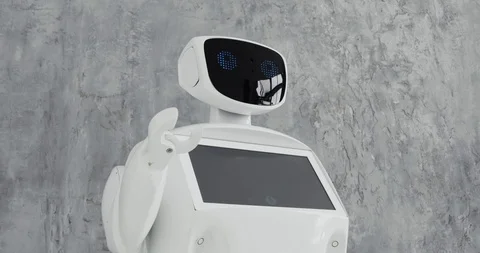 Modern Robotic Technologies. The robot looks at the camera at the person. The Stock Footage 97967535