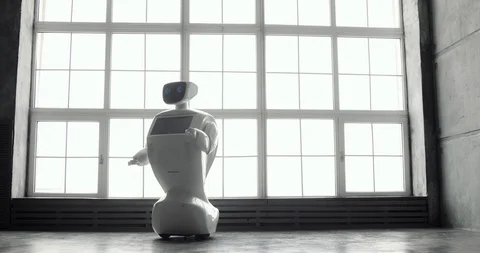 Modern Robotic Technologies. The robot looks at the camera at the person. The Stock Footage 97968013