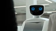 Modern Robotic Technologies. The Robot Looks At The Camera At The Person Stock Footage
