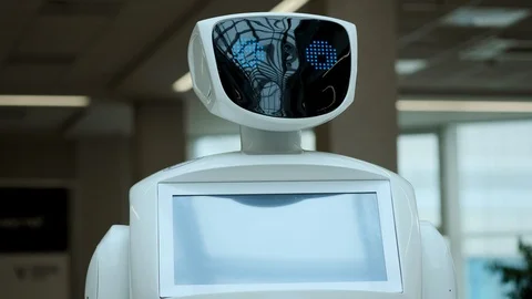 Modern Robotic Technologies. The robot looks at the camera at the person Video stock 99484255