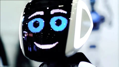 Modern Robotic Technologies. The robot looks at the camera and smile. Stock Footage 116343052