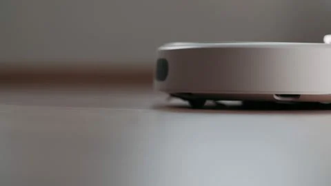 Modern robotic vacuum cleaner. Automatic House Cleaning. Housekeeping. Stock Footage 165724128