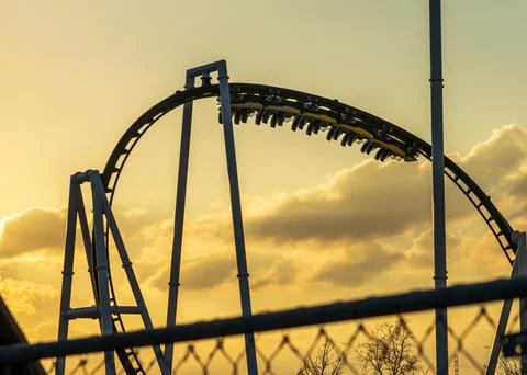 Modern roller coaster under test in Austin with the cars upside down in track Stock Photos