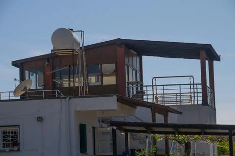 Modern rooftop structure showcasing a blend of architecture and functional .. Stock Photos