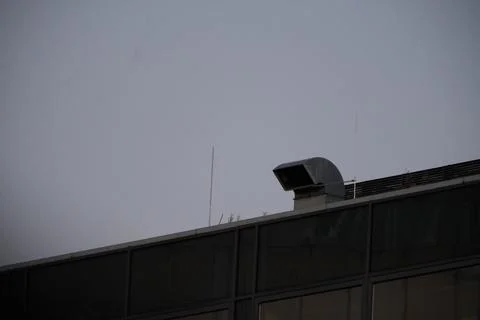 Modern rooftop ventilation system on office building with copy space Stock Photos