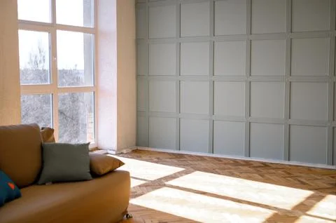 The modern room is empty with large panoramic windows in the living room. Stock Photos