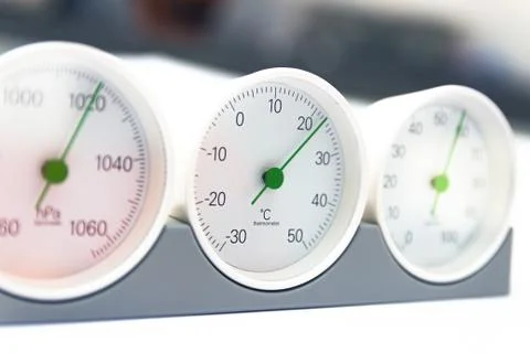 Modern, round barometer, thermometer, hygrometer. Analog device for measuring Foto stock