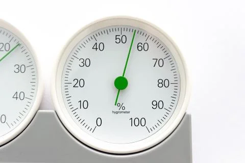 Modern, round barometer, thermometer, hygrometer. Analog device for measuring Stock Photos