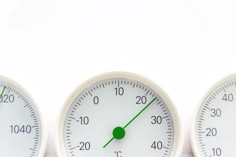 Modern, round barometer, thermometer, hygrometer. Analog device for measuring Stock Photos