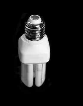 Modern saving lamp on black background isolated Stock Photos