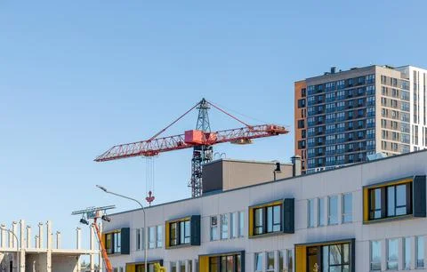Modern school building under construction beside a tower crane. Panel struc.. Stock Photos