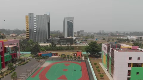 Modern school complex and skyscrapers in Malabo city, Equatorial Guinea Stock Footage 129953656