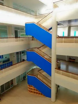 A modern school interior with a bright and airy atrium Stock Photos