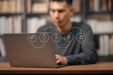Modern scientist analyzing health data on computer with futuristic icons in.. Фото