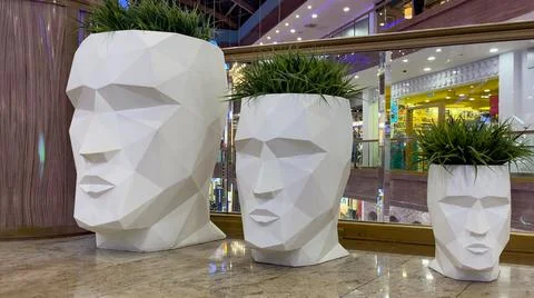 Modern sculpture of a head with grass instead of hair Stock Photos