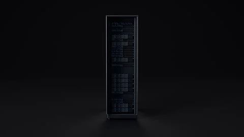 A modern server rack stands alone against a dark background, representing data Stock Footage 347761990