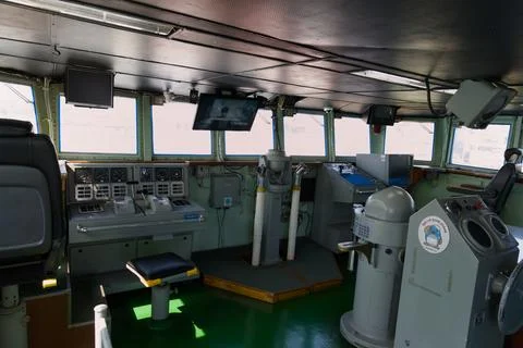 Modern Ship Bridge Interior with Navigation Consoles Photos
