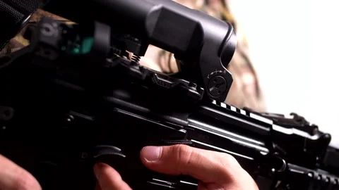 A modern sighting system on a combat rifle in the hands of a military soldier Stock Footage 158015233