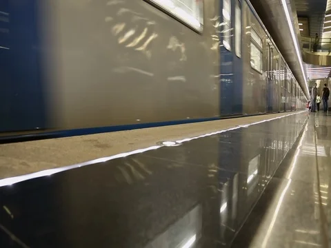 Modern silver blue metro train moving Stock Footage 77582601