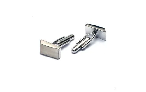 Modern silver cufflinks isolated on white Foto stock