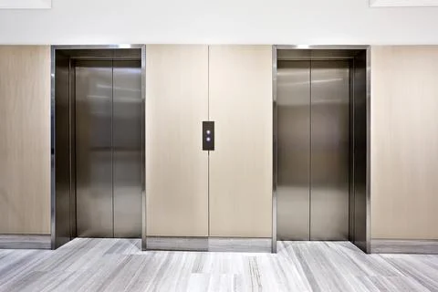 Modern silver elevator in a luxury building Stock Photos