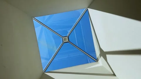 A modern skylight lets natural light flood into a room with a bright, Stock Footage 285060507