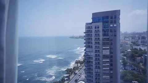 A modern skyscraper apartment building stands tall against the backdrop of the Stock Footage 345182972