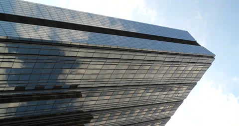 Modern Skyscraper with Clouds reflecting vertical Stock Footage 208128677