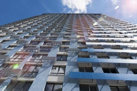 Modern skyscraper facade with blue sky and sun flare Stockfoto's