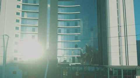 Modern skyscraper glass facade with sun flare reflection Stock Footage 327227817