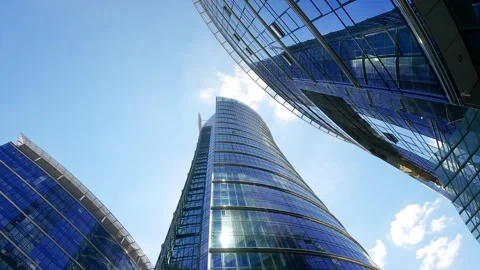 Modern skyscraper looking up towards the sunny sky Stock Footage 345138941
