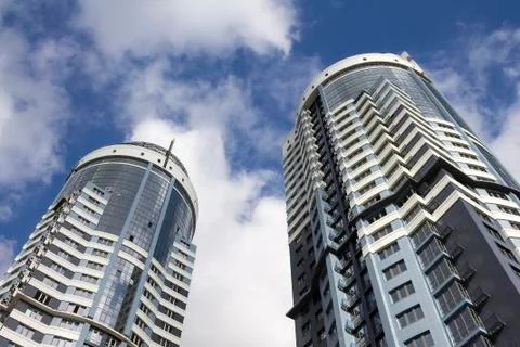 Modern skyscraper perspective ground view on sky background Stock Photos