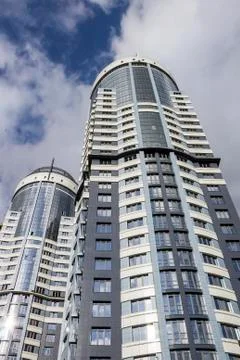 Modern skyscraper perspective ground view on sky background Stock Photos