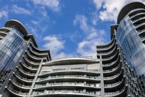 Modern skyscraper perspective ground view on sky background Stock Photos