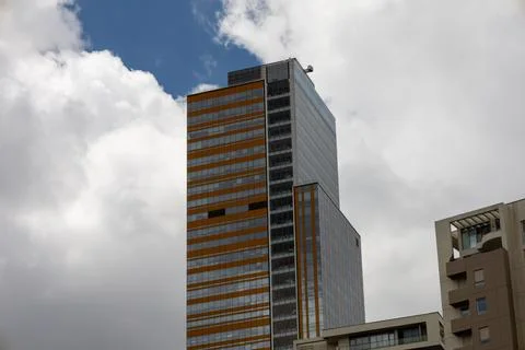 Modern Skyscraper Reaching for the Cloudy Sky Stock Photos