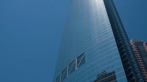 Modern Skyscraper with Reflective Glass Facade Stock Footage 293909194