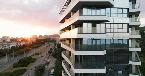 Modern skyscraper sharp angles glass walls capturing urban reflections aerial Stock Footage 301872850