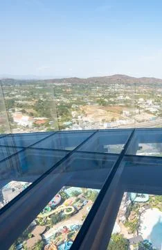 A modern skyscraper, structural glass floor and transparent frameless balus.. Fotos de archivo