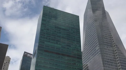 Modern skyscraper UN building blue sky New York City corporate office business  Stock Footage 48890796