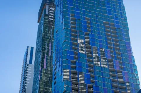 Modern skyscraper wall texture with glossy reflection Stock Photos