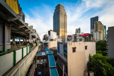 Modern skyscrapers and skytrain platform in the Sukhumvit district, in Bangko Stock Photos