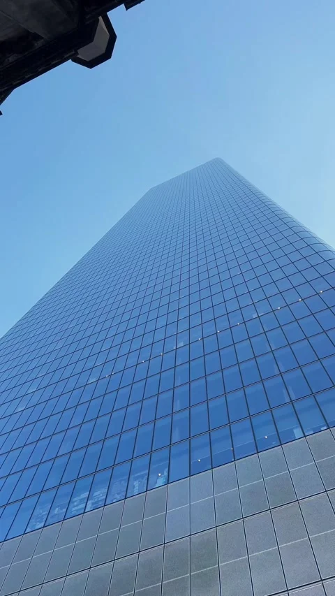 Modern Skyscrapers Tower Elegantly Under a Clear Blue Sky Above Them 動画素材 291639198