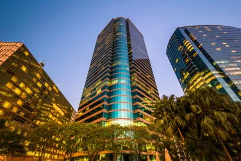 Modern skyscrapers at Tsim Sha Tsui at twilight, in Kowloon, Hong Kong. Stock Photos