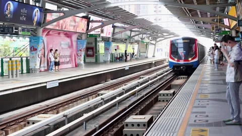 Modern Skytrain Arriving at Elevated Bangkok Transit Platform Stock Footage 324350851